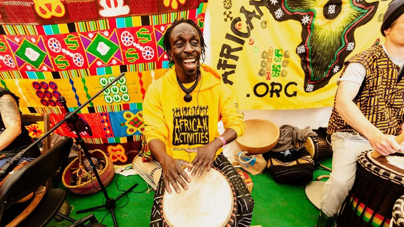 Drum workshop Camp Bestival Oumar Sagna leading a drum workshop at Cam Bestival 2024