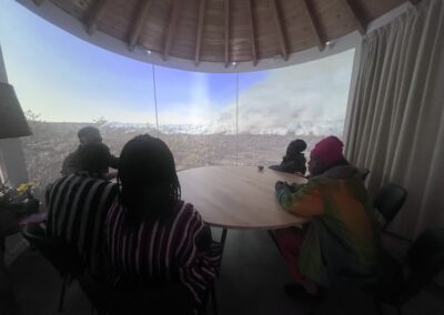 Black guests of African and Caribbean heritage listen as Tom from SPUD explains the film’s creation during a Nightjar workshop.
