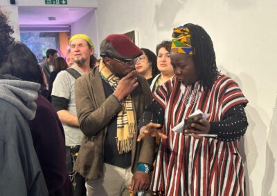 Representatives of the Nigerian and Ghanaian Societies meet over the artwork at the opening night of the Nightjar